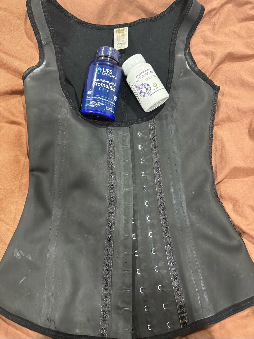 Ann Chery Black Waist Trainer with Blue Supplement Bottle